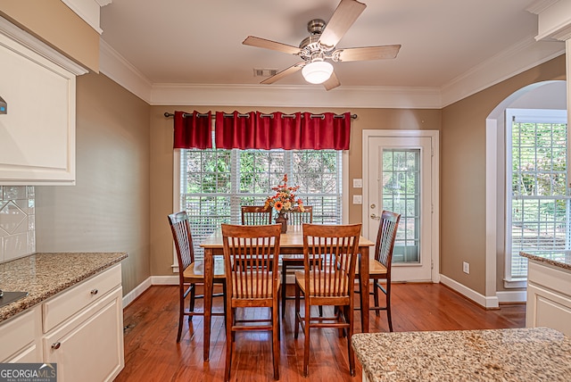 dining area with ornamental molding, hardwood / wood-style flooring, and ceiling fan