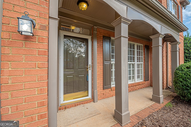 doorway to property with a porch