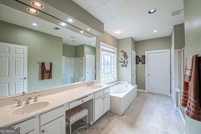 bathroom with vanity and separate shower and tub