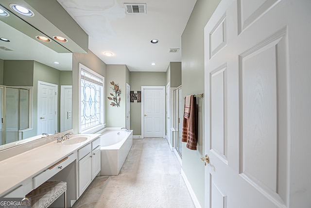 bathroom featuring vanity and shower with separate bathtub