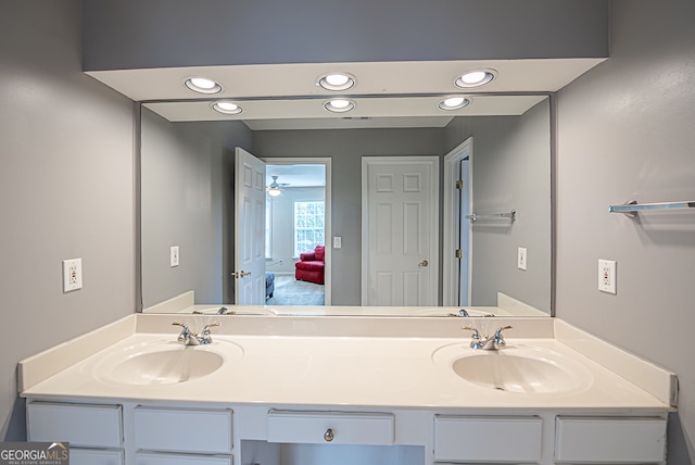 bathroom featuring ceiling fan and vanity