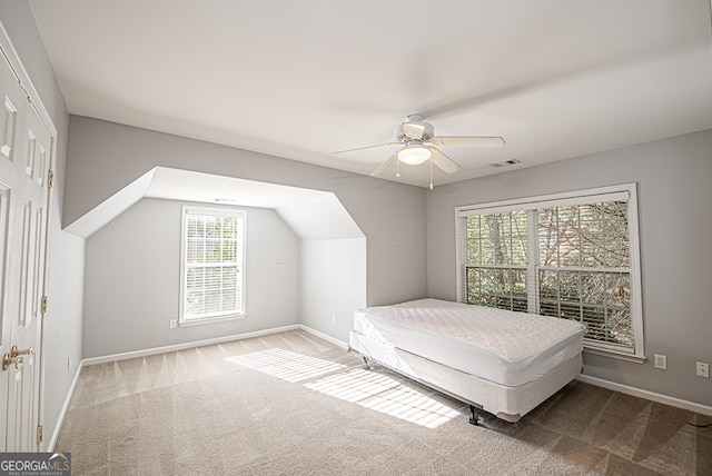 bedroom featuring carpet, multiple windows, and ceiling fan