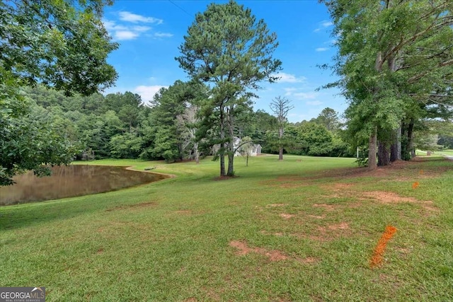 view of yard with a water view