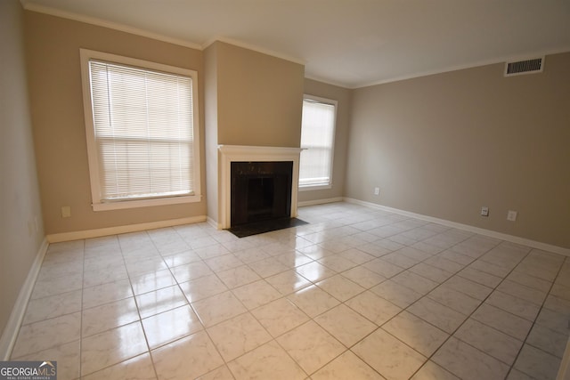 unfurnished living room with crown molding and light tile patterned floors