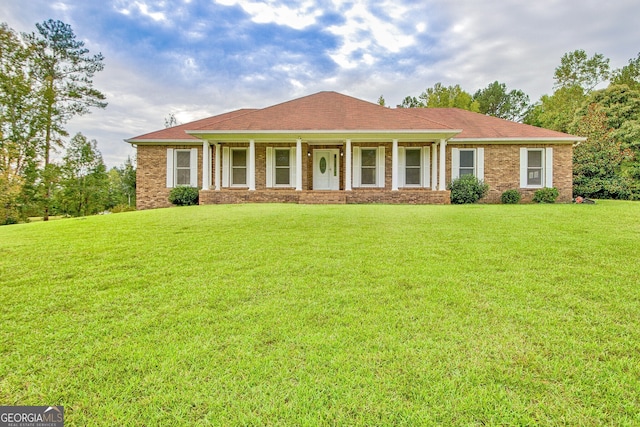 ranch-style house with a front lawn