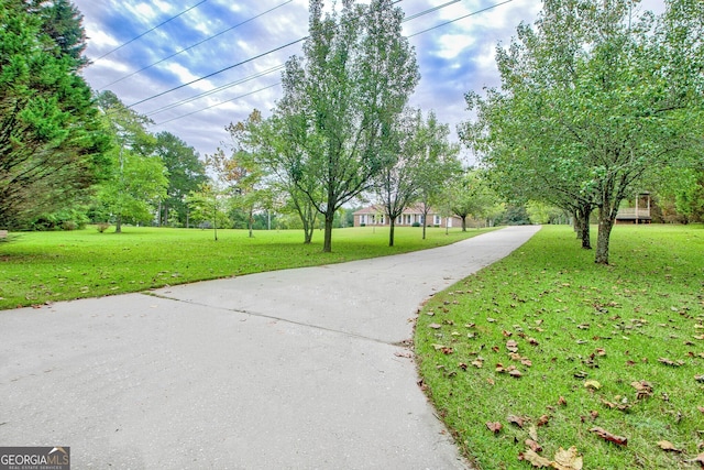 view of home's community featuring a yard