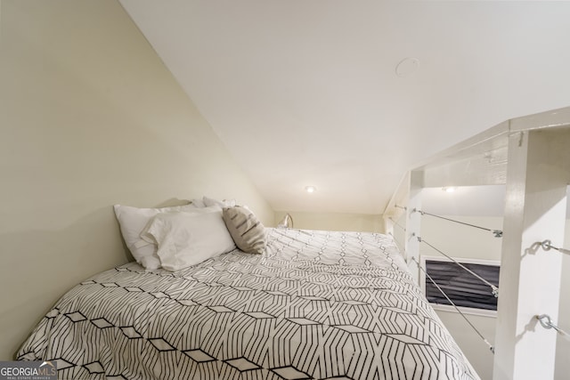 bedroom with lofted ceiling