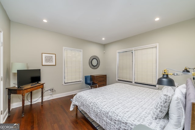 bedroom featuring dark hardwood / wood-style flooring