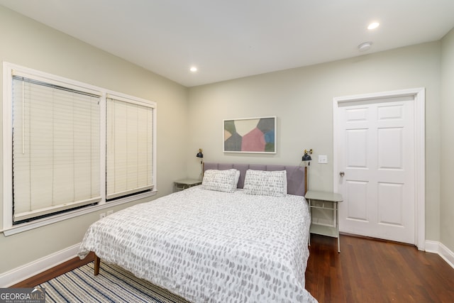 bedroom featuring dark wood-type flooring