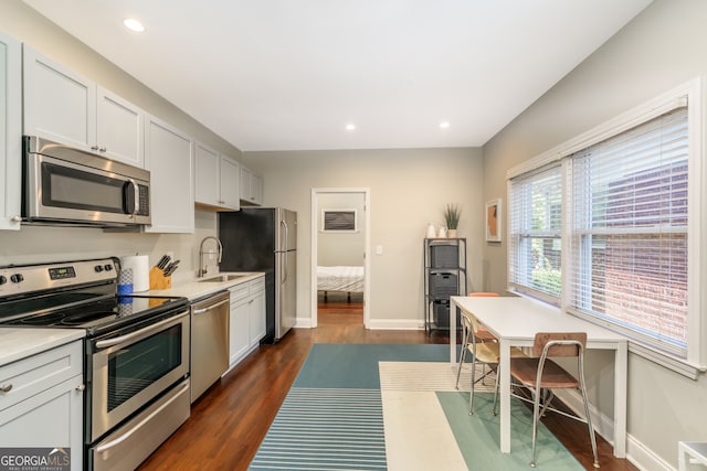 kitchen with plenty of natural light, gas stove, and white cabinetry