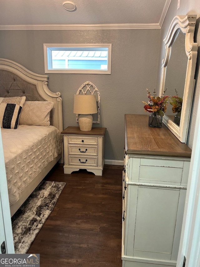 bedroom featuring crown molding and dark wood-type flooring