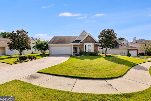 view of front of home with a front yard and a garage