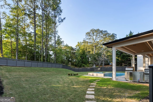 view of yard featuring a fenced in pool