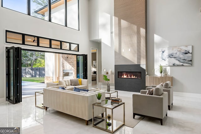 living room featuring a towering ceiling