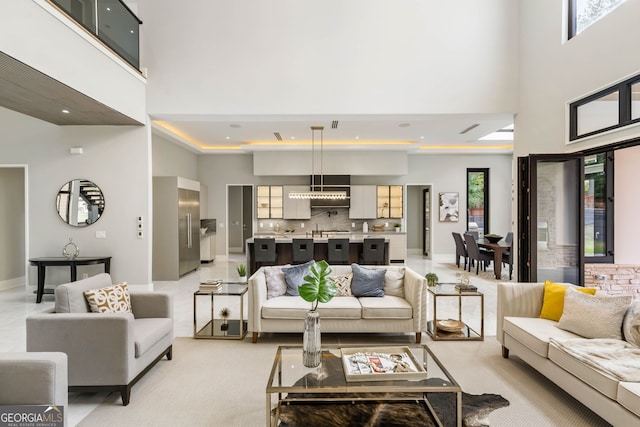 living room featuring a high ceiling