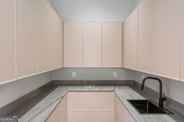 kitchen with sink and white cabinets