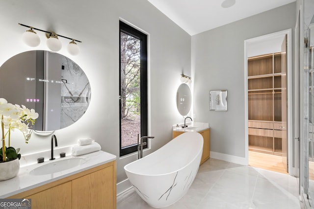 bathroom with vanity, independent shower and bath, and tile patterned flooring