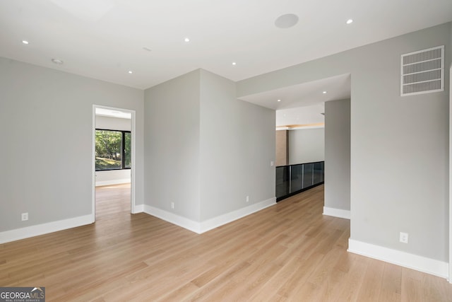 spare room featuring light wood-type flooring