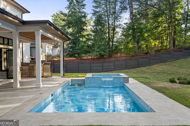 view of swimming pool featuring a patio, pool water feature, and a yard