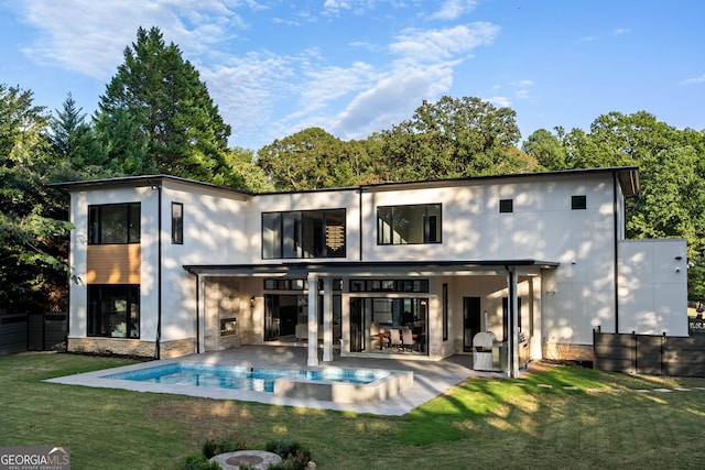 rear view of property with a patio area and a lawn