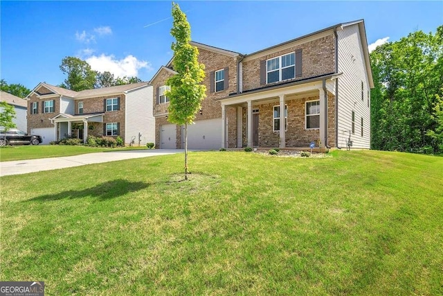 view of front of house featuring a garage and a front lawn