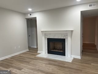 unfurnished living room with hardwood / wood-style flooring