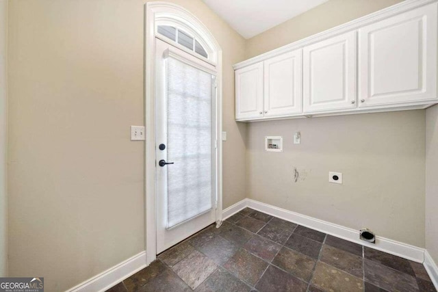 laundry room with stone tile flooring, baseboards, washer hookup, cabinet space, and electric dryer hookup