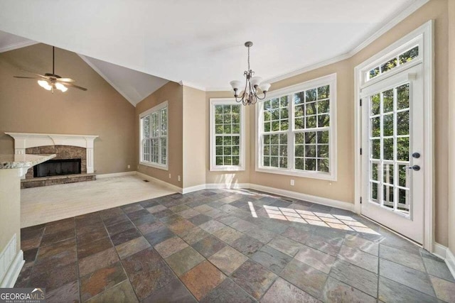 unfurnished living room featuring ceiling fan with notable chandelier, plenty of natural light, vaulted ceiling, and crown molding