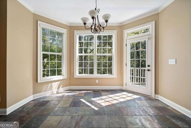 doorway to outside featuring baseboards, stone tile floors, and crown molding