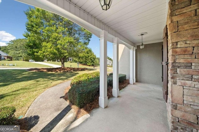view of patio featuring a porch