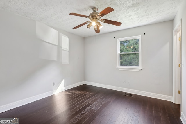 spare room featuring a textured ceiling, ceiling fan, and dark hardwood / wood-style flooring