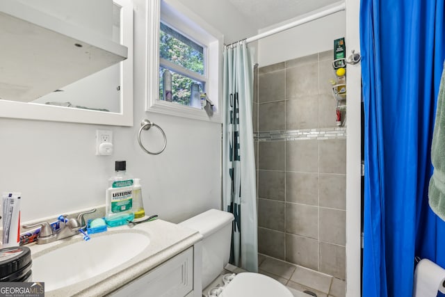 bathroom featuring vanity, toilet, tile patterned flooring, and a shower with shower curtain