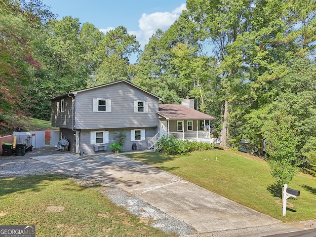 tri-level home with a front yard