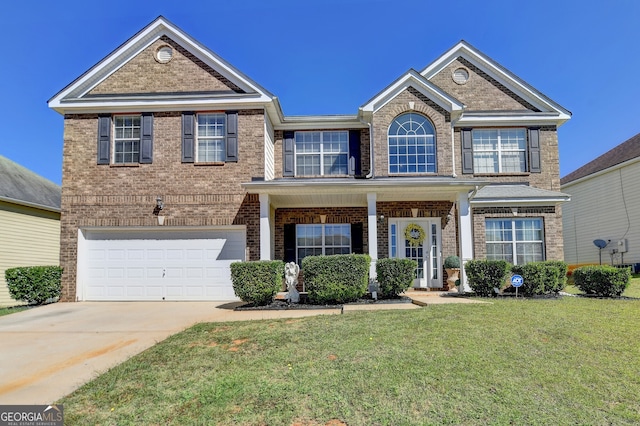 view of front of home with a garage and a front lawn