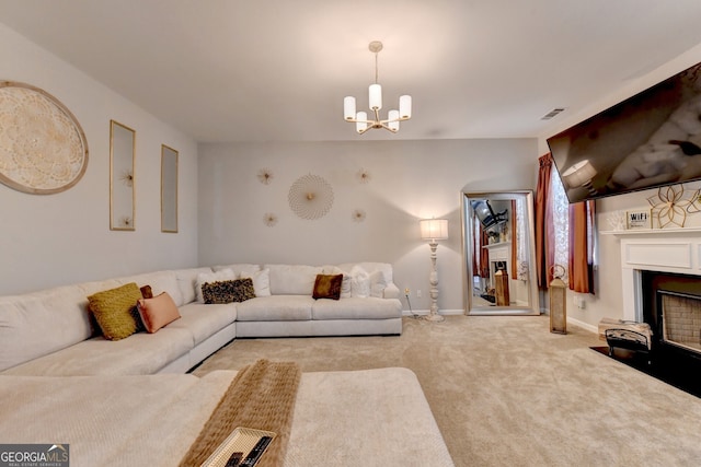 carpeted living room featuring a chandelier