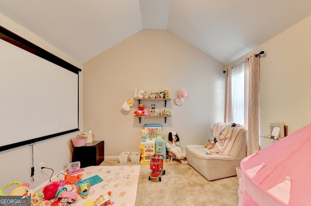 playroom featuring light carpet and vaulted ceiling