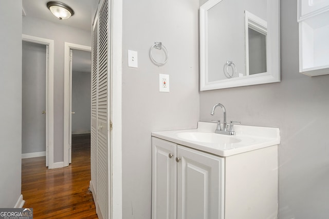 bathroom featuring vanity and hardwood / wood-style flooring