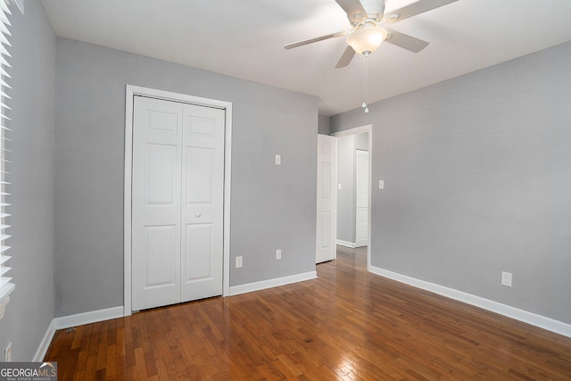 unfurnished bedroom with a closet, ceiling fan, and hardwood / wood-style floors