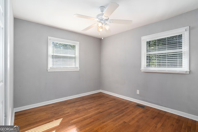 spare room featuring hardwood / wood-style flooring and ceiling fan