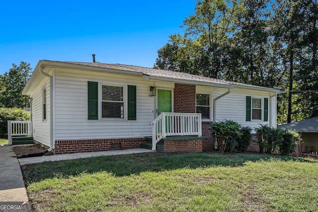 ranch-style home with a front yard