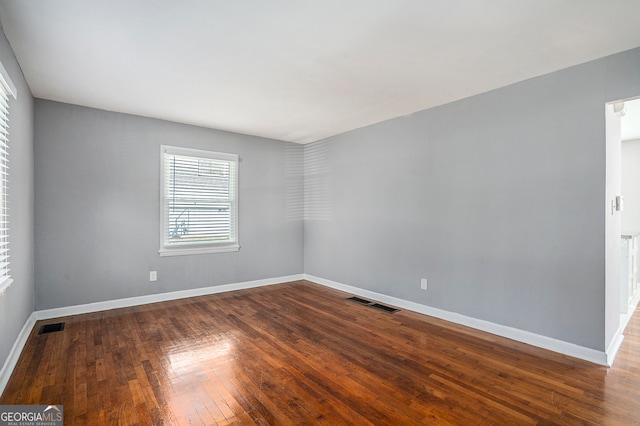 empty room with wood-type flooring