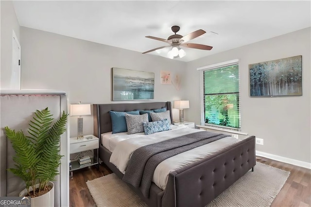 bedroom featuring ceiling fan and dark hardwood / wood-style flooring