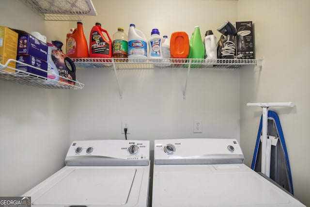 laundry room with washing machine and clothes dryer