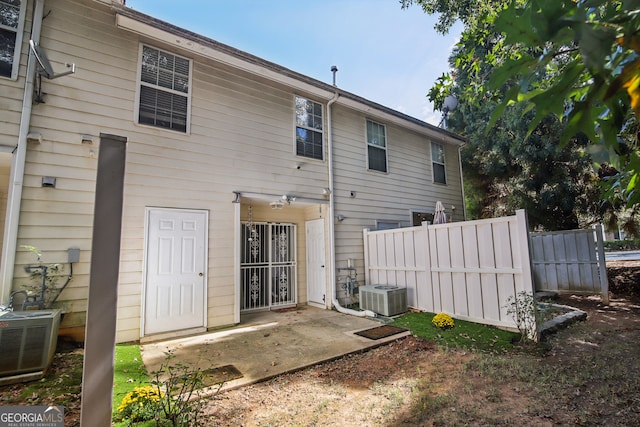 rear view of house featuring central AC and a patio