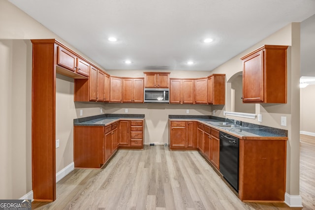 kitchen with dishwasher, light hardwood / wood-style floors, and sink