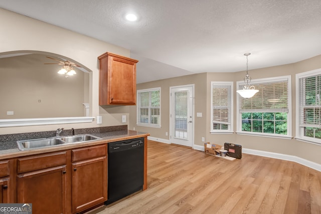 kitchen featuring a textured ceiling, ceiling fan, sink, black dishwasher, and light hardwood / wood-style floors