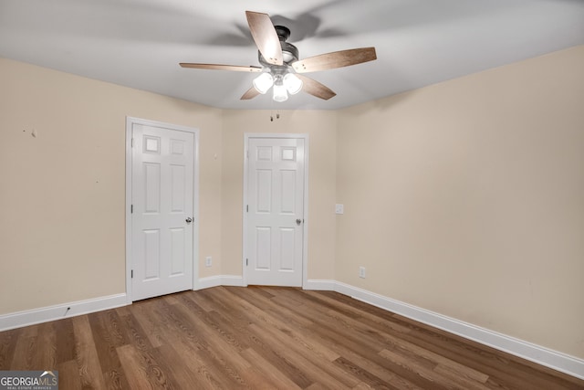 unfurnished bedroom featuring ceiling fan and wood-type flooring