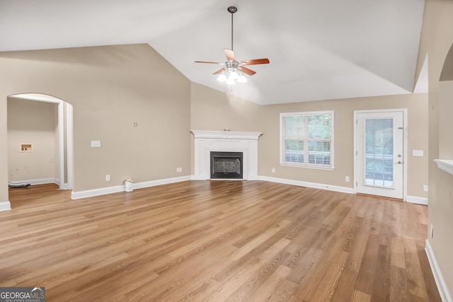 unfurnished living room with ceiling fan, light hardwood / wood-style flooring, and lofted ceiling