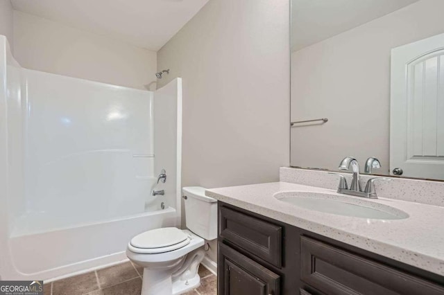 full bathroom with tile patterned floors, vanity, toilet, and shower / tub combination