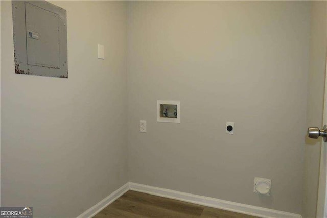 clothes washing area featuring washer hookup, electric panel, dark wood-type flooring, and hookup for an electric dryer